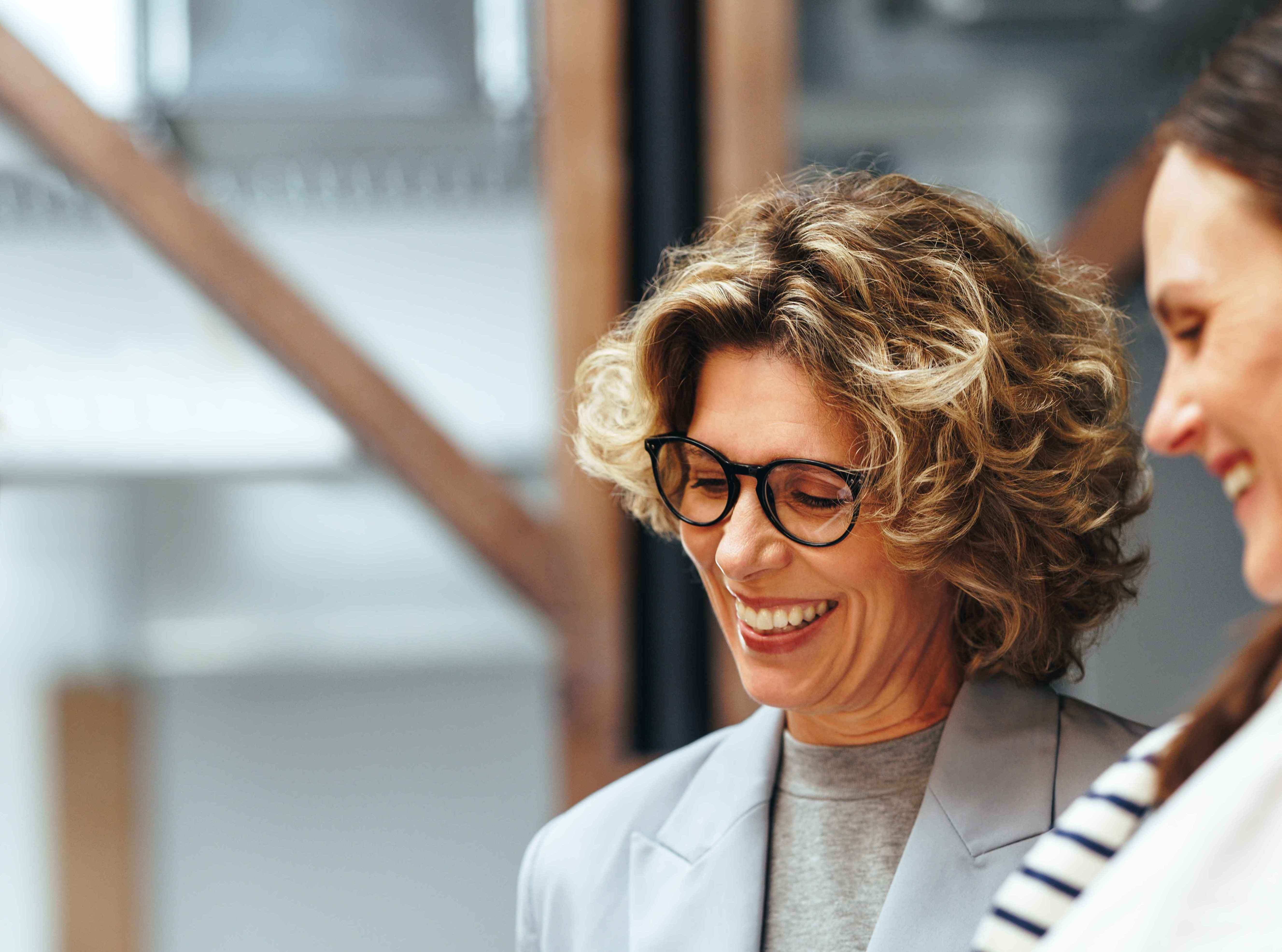 Professionals listening to a speaker at a conference