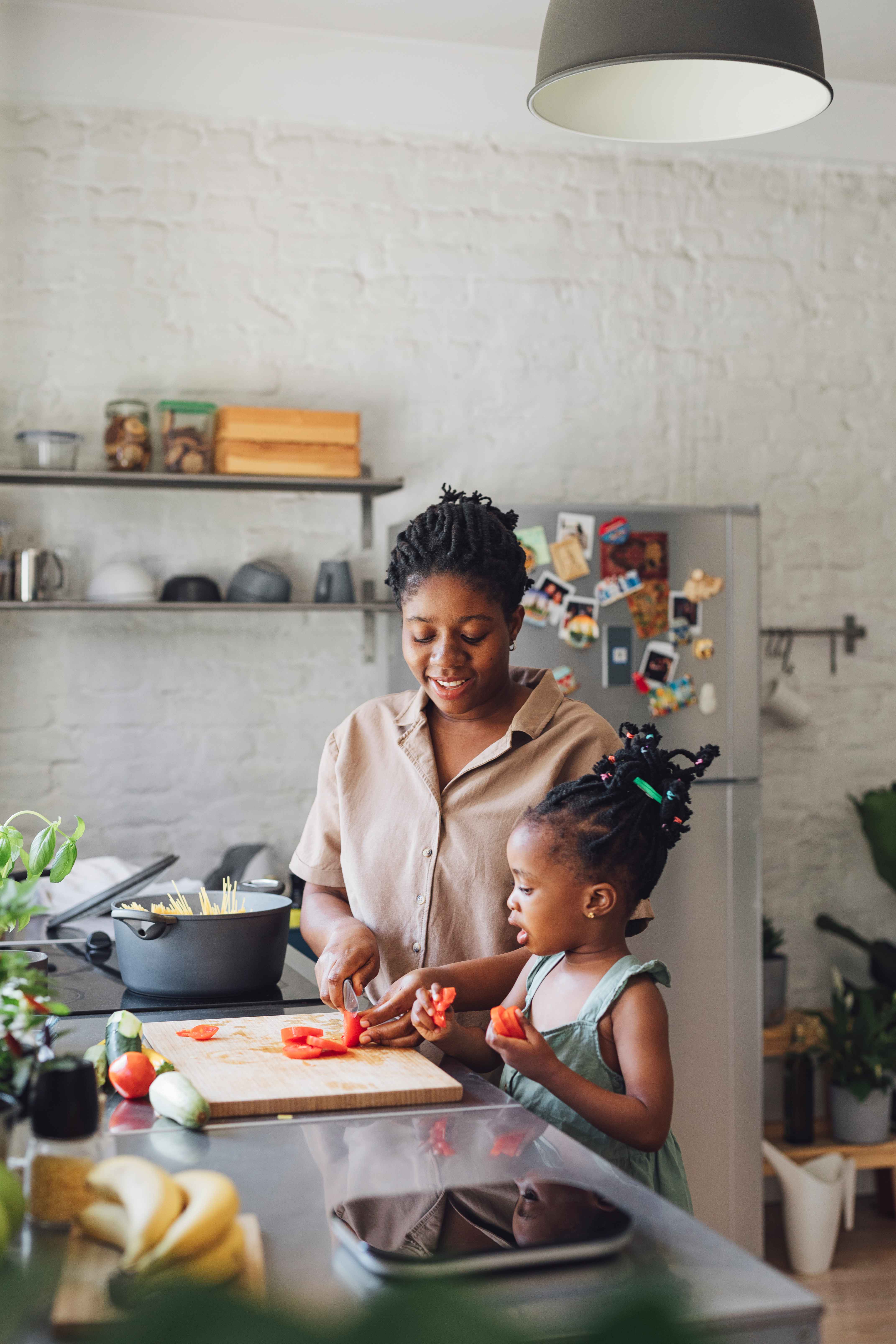 Mother and daughter cooking