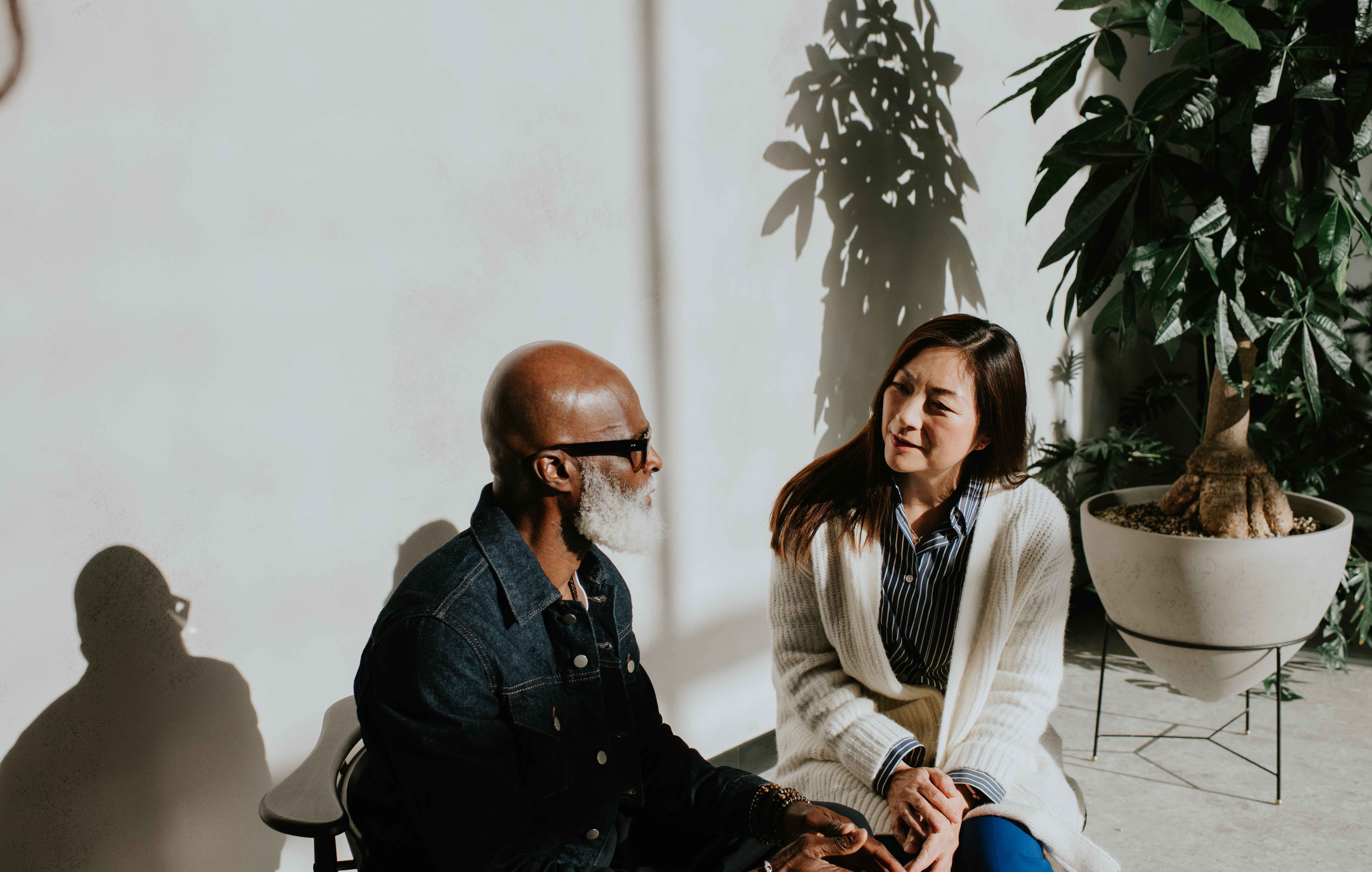 Two friends talking on a porch