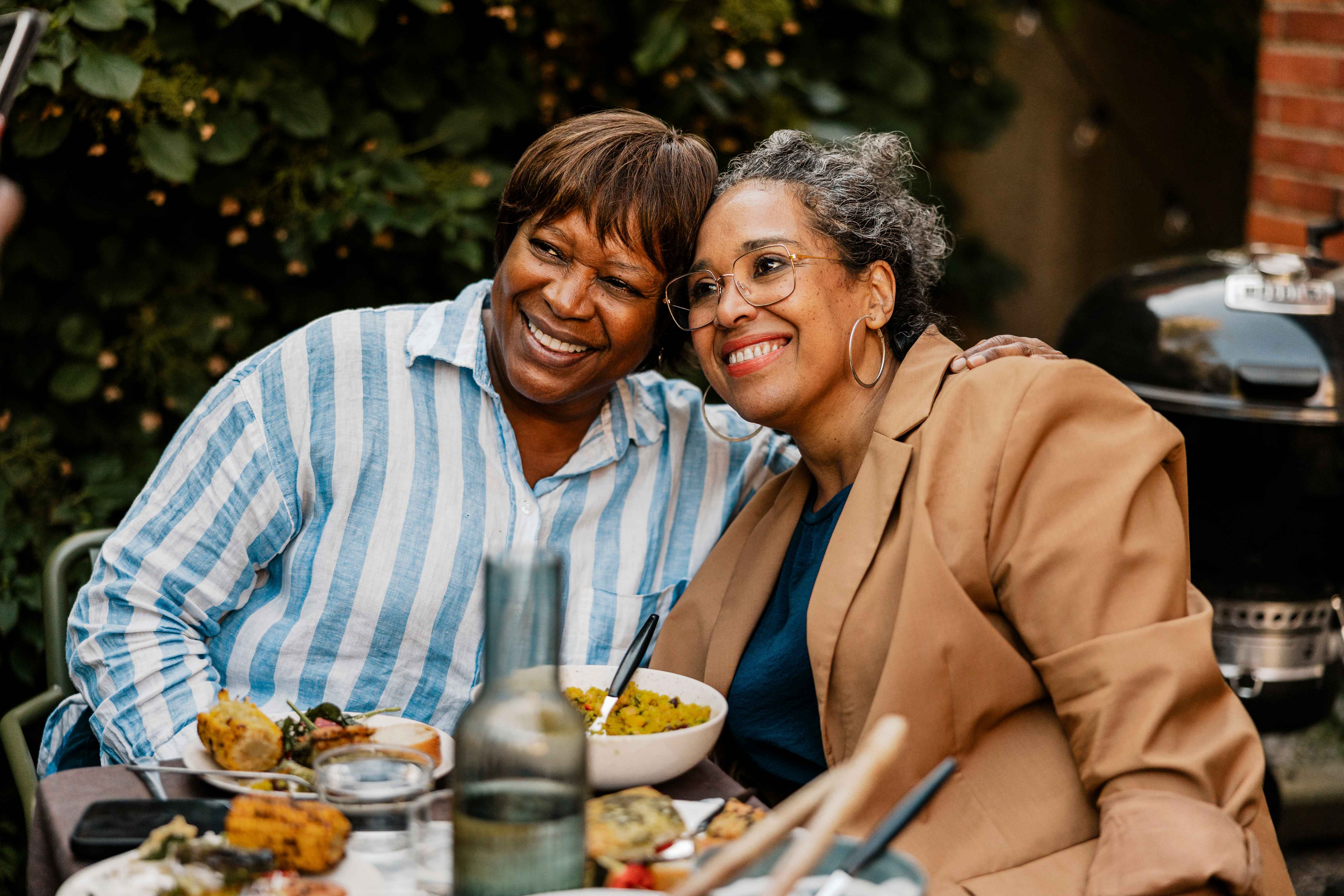two women eating in an outdoor cafe