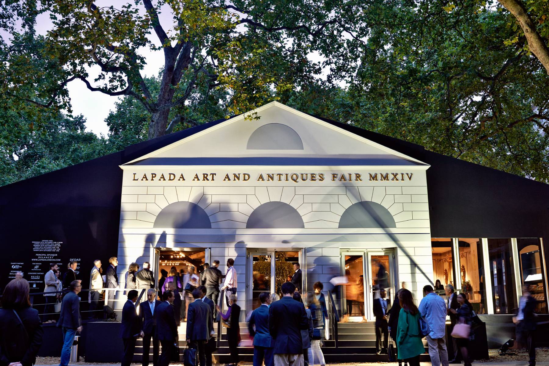 Art fans mill around the front of the LAPADA Art and Antiques Fair marquee in Mayfair