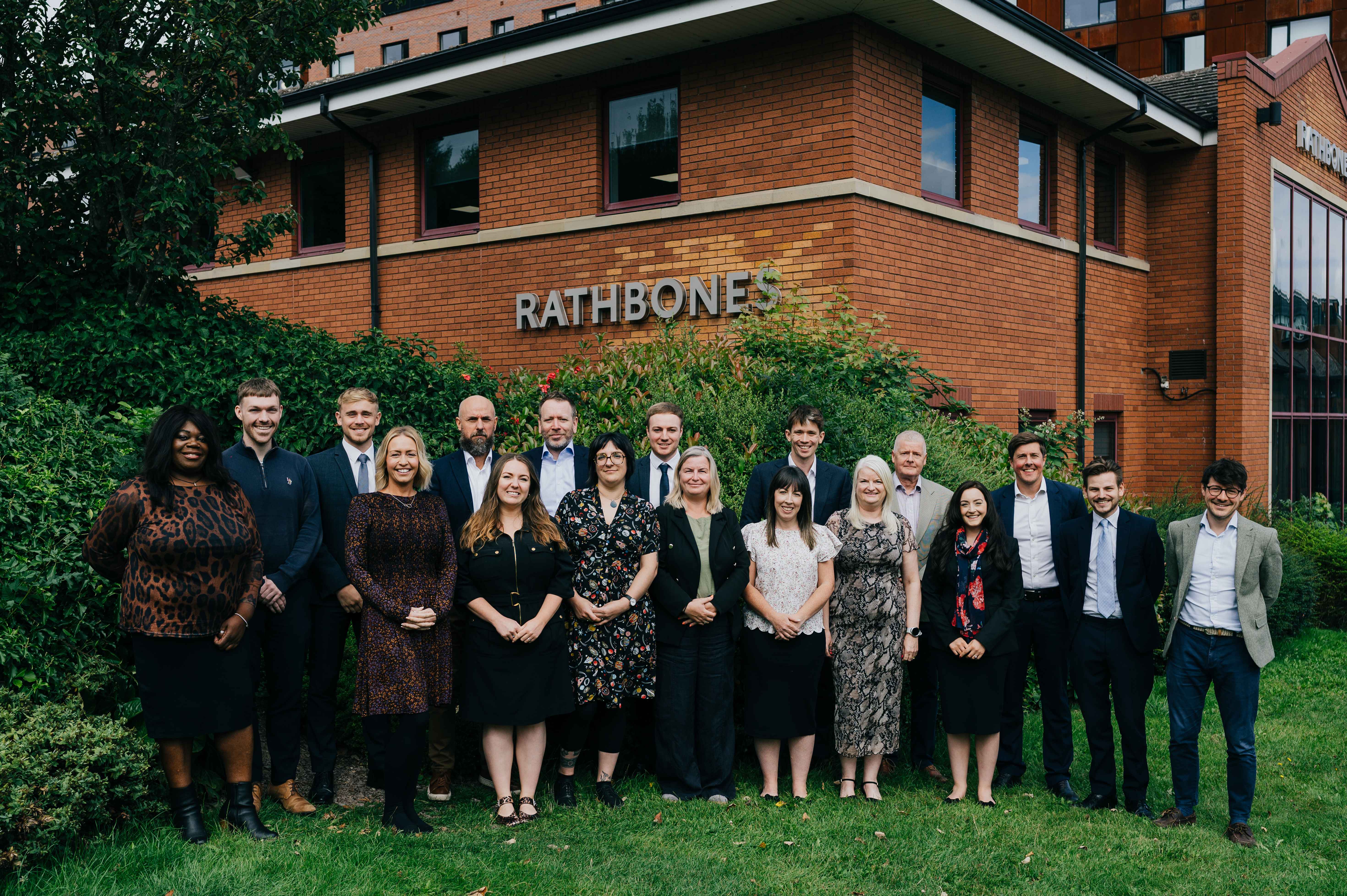 Meet the team of the Sheffield office standing outside the office building