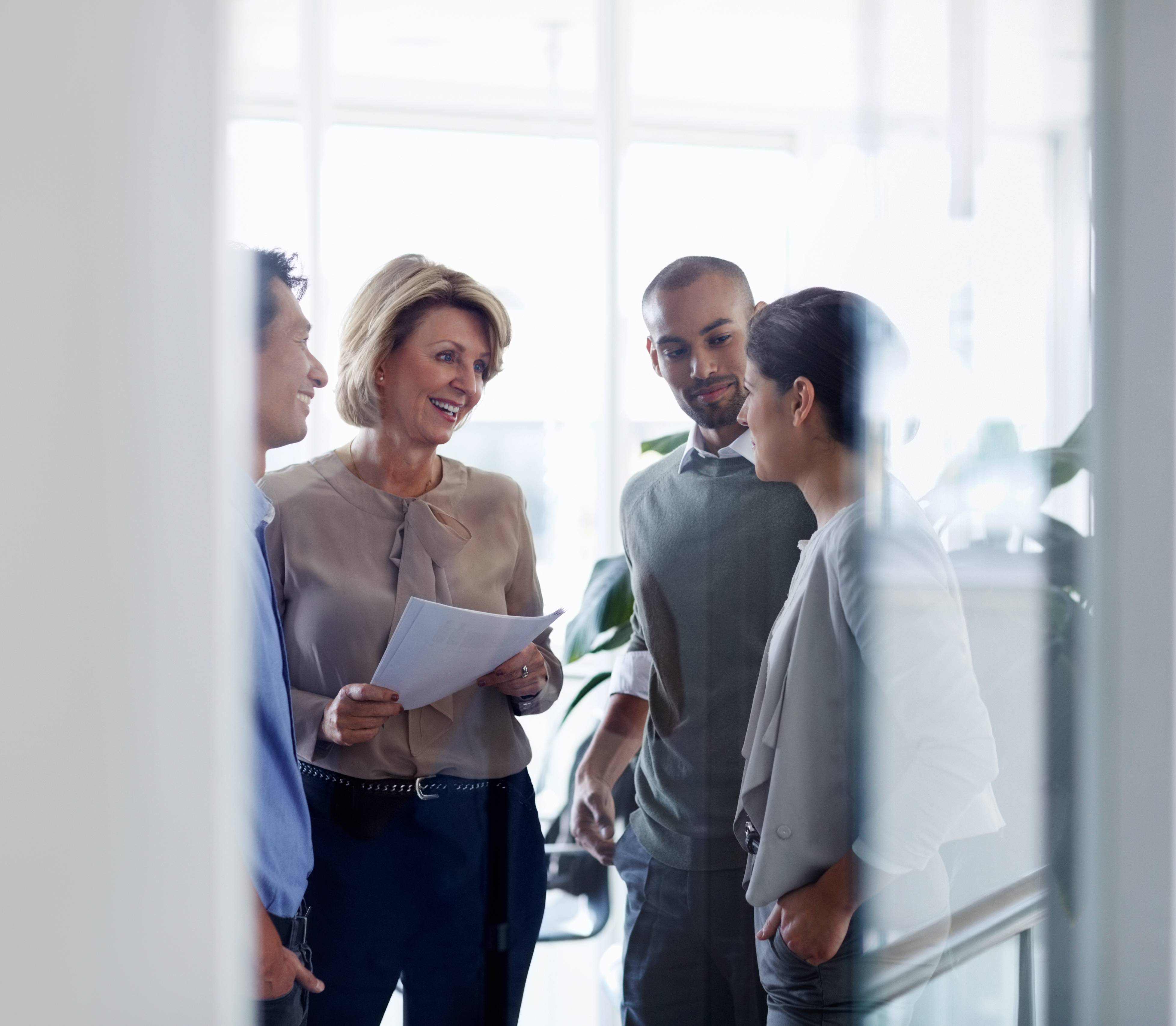 Businesswoman discussing with colleagues