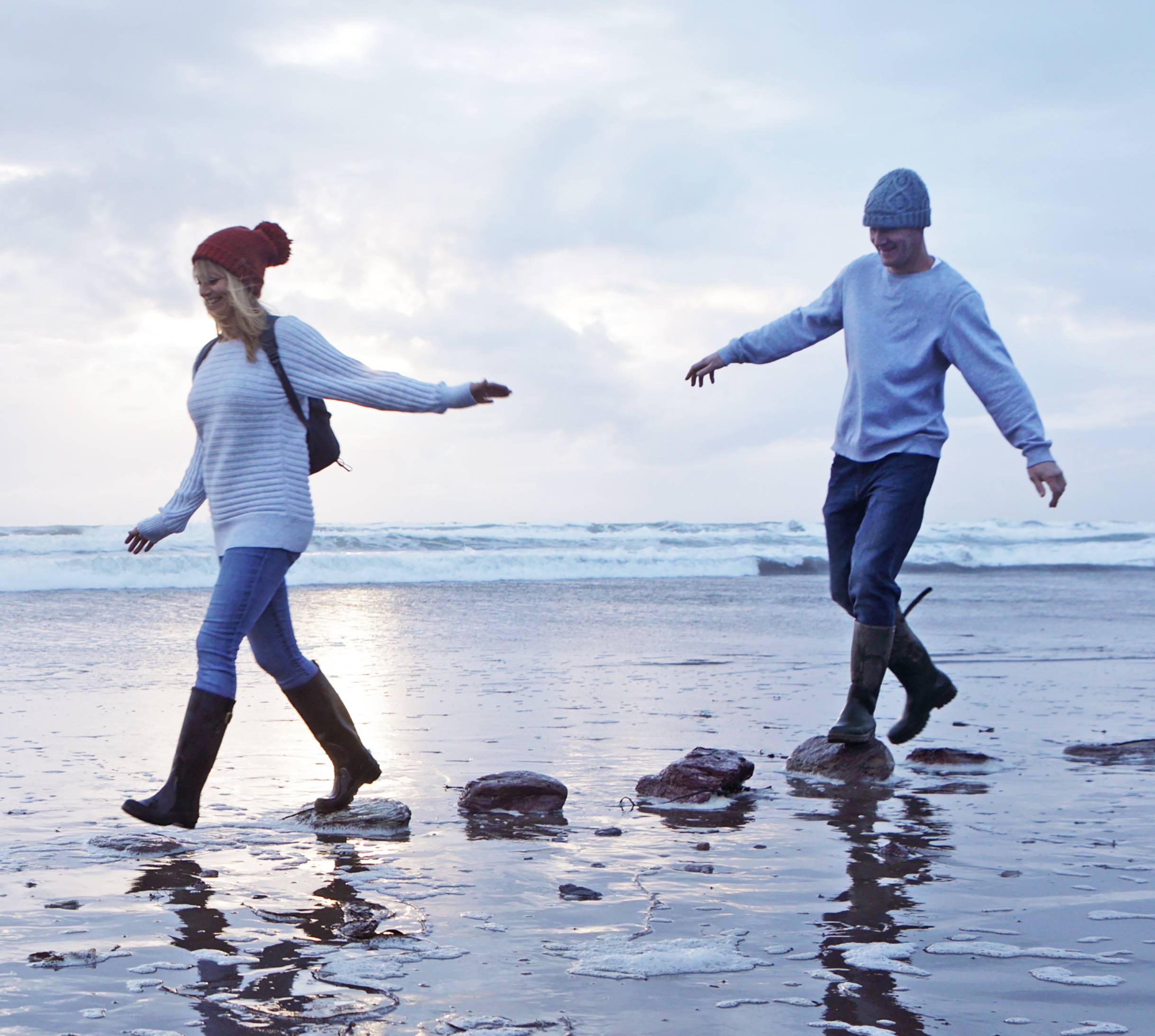 Couple walking on a beach together