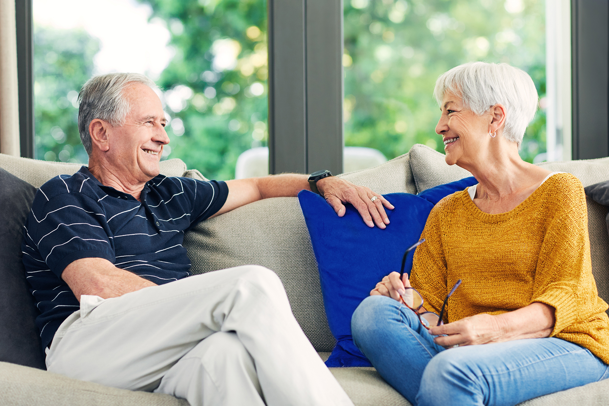 Couple on sofa talking