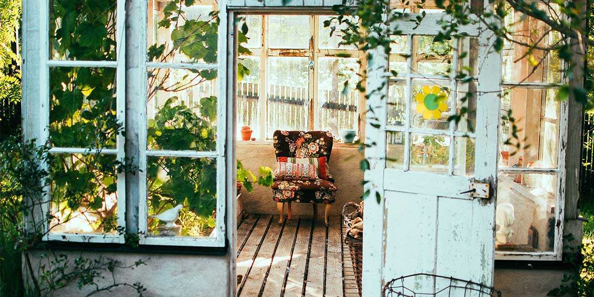 Greenhouse with cosy armchair