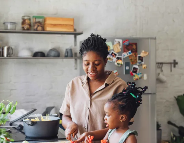 Mother and daughter cooking