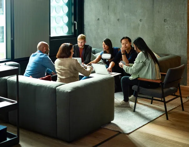 Professionals listening to a speaker at a conference