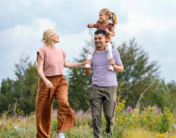 A family walk in the outdoors together