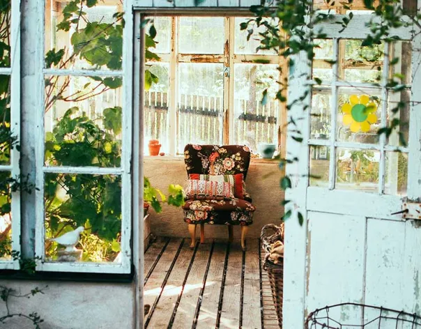 Greenhouse with cosy armchair