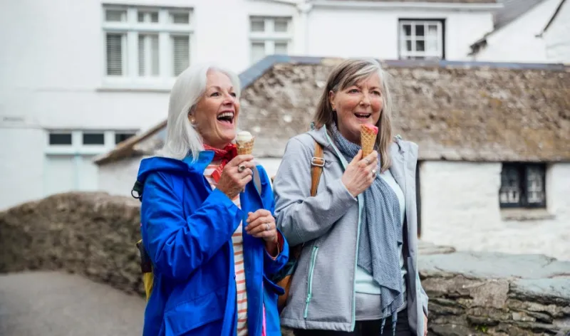 Two women enjoying ice cream on a relaxed day out, representing the freedom and confidence that comes from effective financial planning