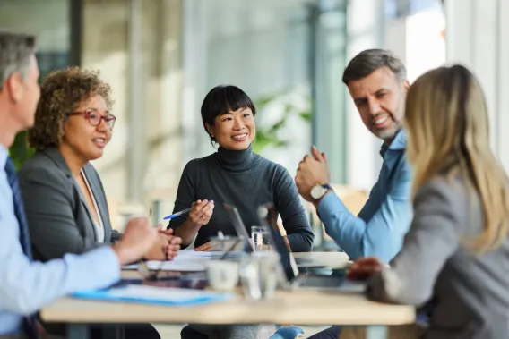 A team of financial advisers meet together