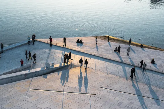 People walking along a waterfront location