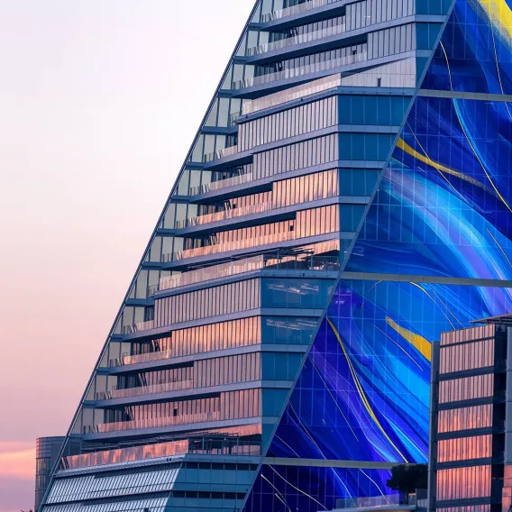 A close-up view of city skyscrapers as sunlight reflects of their windows