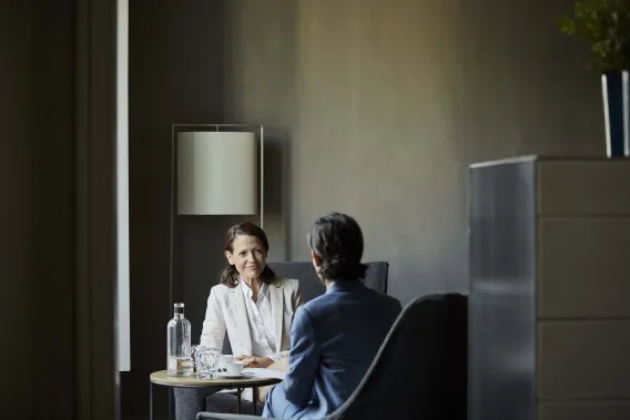 Two people talking in a room