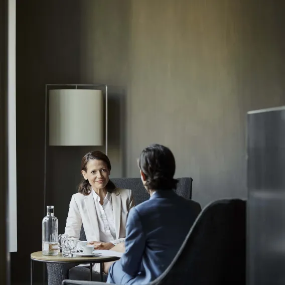 Two people talking in a room