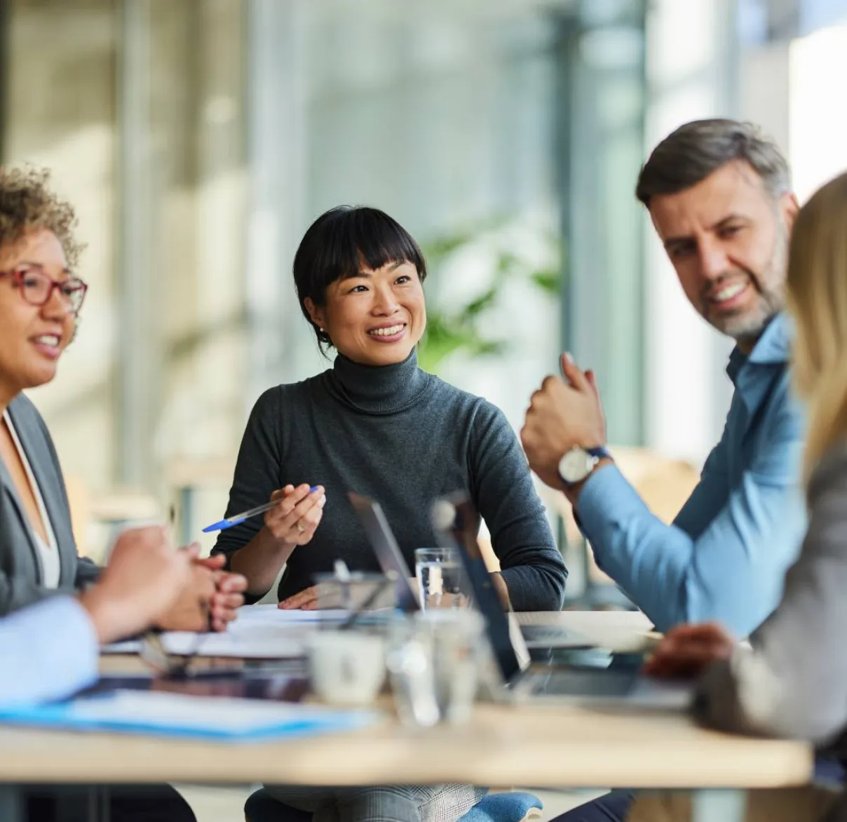 A team of financial advisers meet together
