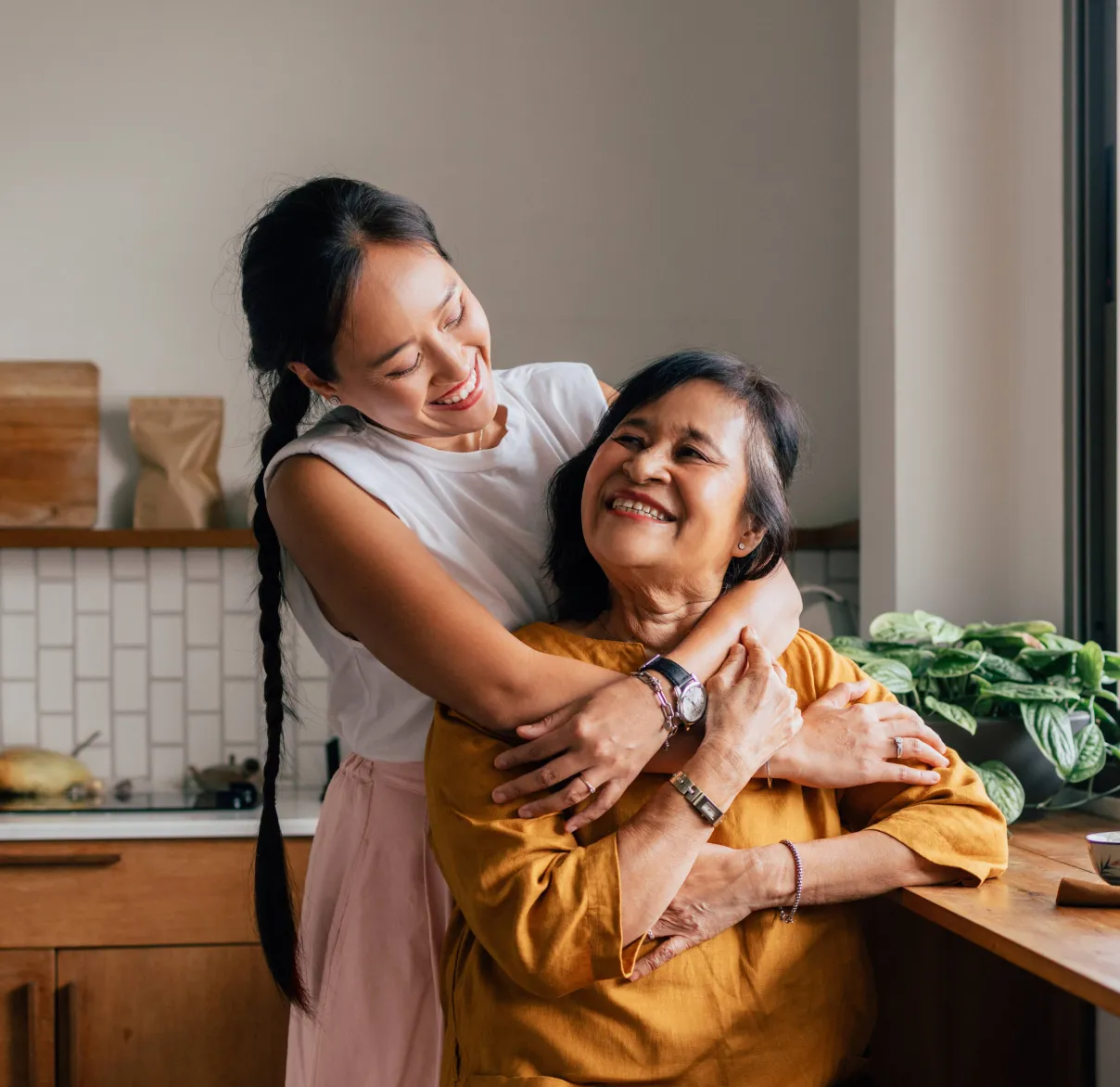 Two women who are friends are talking as they walk down the street