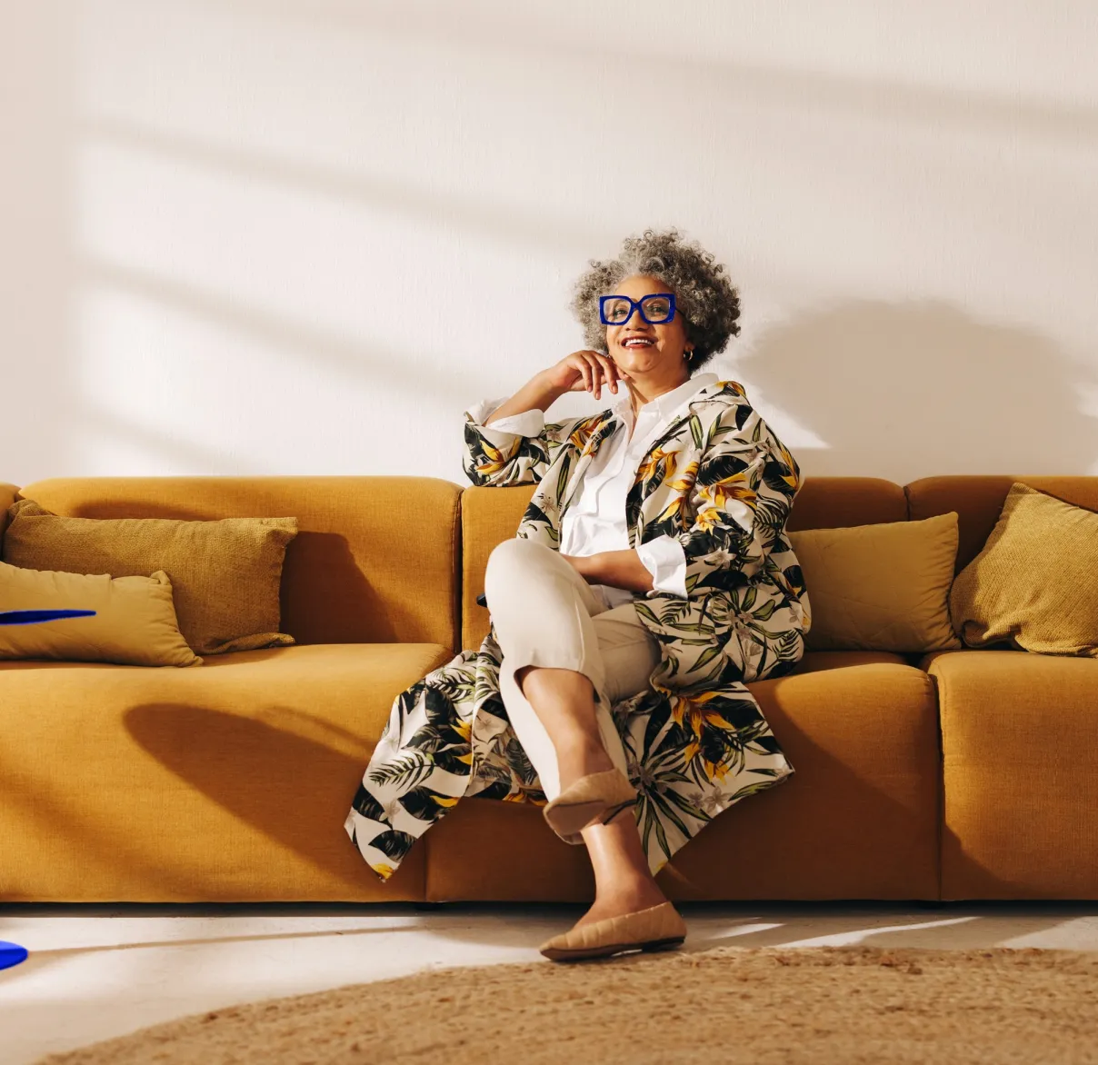 Two women walk along a suburban American street talking and laughing