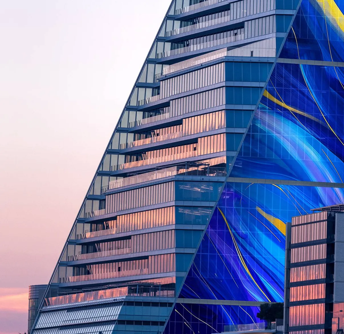 A close-up view of city skyscrapers as sunlight reflects of their windows