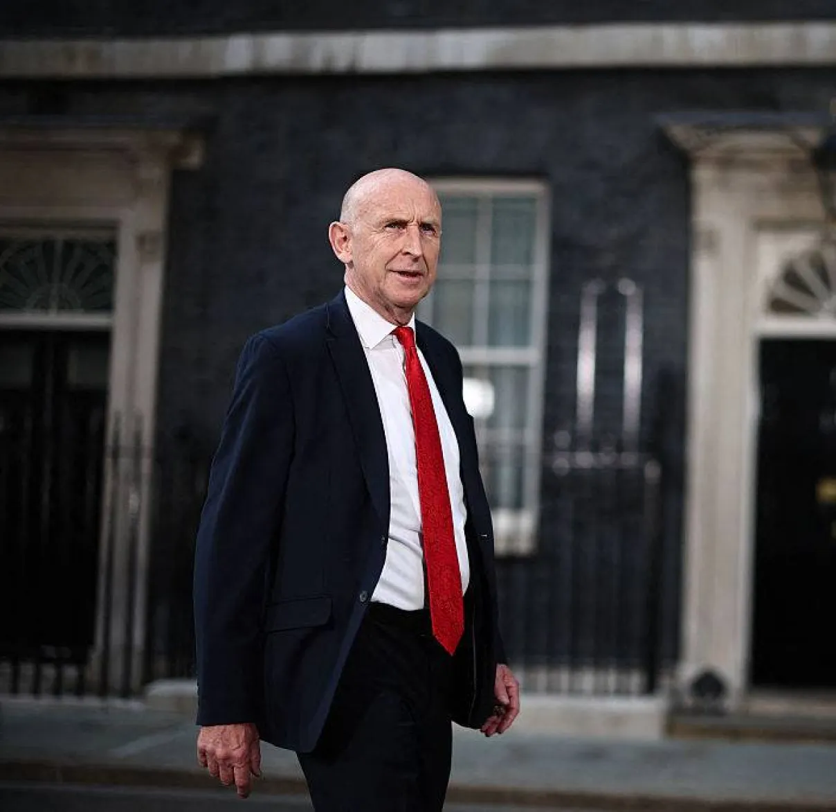 John Healey, UK Chancellor of the Exchequer, walks in front of Number 10 Downing Street