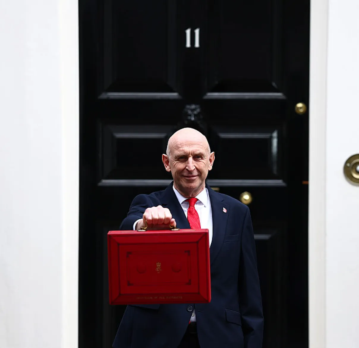 John Healey, UK Chancellor of the Exchequer, stands in front of Number 11 Downing Street