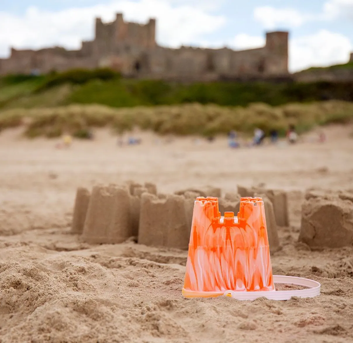 A series of sand castles built on the beach