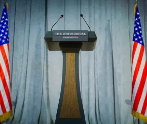 image of empty podium with usa flags