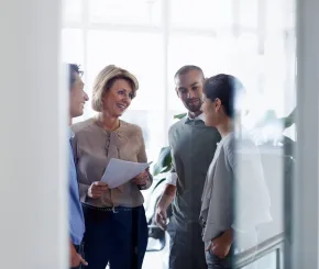 Businesswoman discussing with colleagues