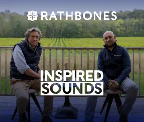 An image for the Inspired Sounds podcast showing two people looking out over a vineyard