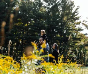 Family walking together in the woods