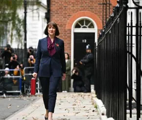 Rachel Reeves walks past eleven Downing Street with the red Budget box