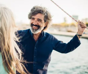 Man smiling while on a boat