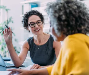 Two professional women in discussion 