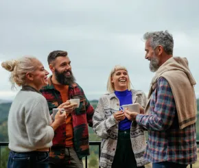 Fours friends having coffee and conversation