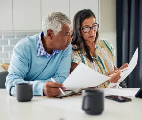 Man and woman looking at papers