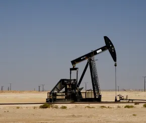 Nodding donkey on sand