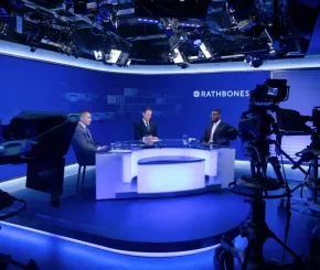 A panel discussion with three men