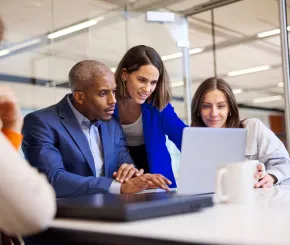 Four colleague working together in a meeting in the office