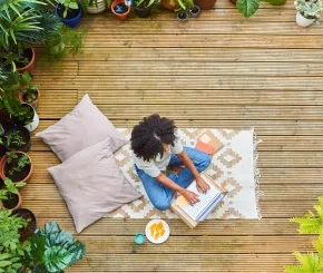 Woman working on her laptop in the garden