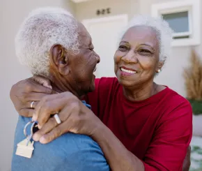 Happy couple celebrating house purchase