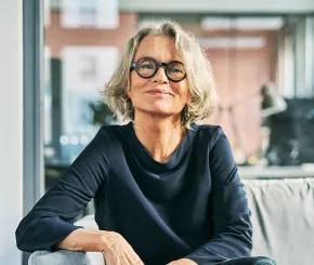 Woman with glasses smiling