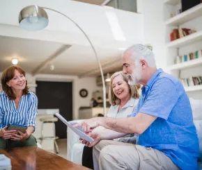 IFA speaking to older couple