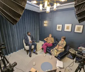Three people in a panel discussion
