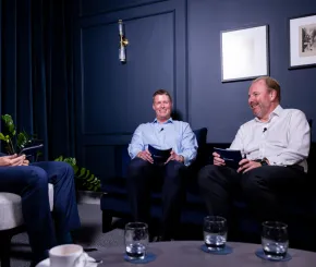 Three men speaking on a panel for a webinar