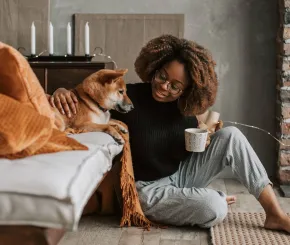 Woman and her pet dog at home