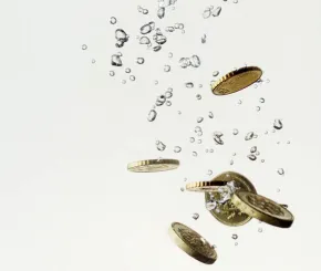 Pound coins dropped in water