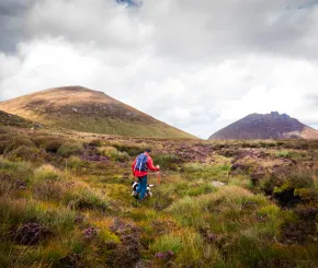 man-walking-in-the-mourne-mountains-in-northern-ireland