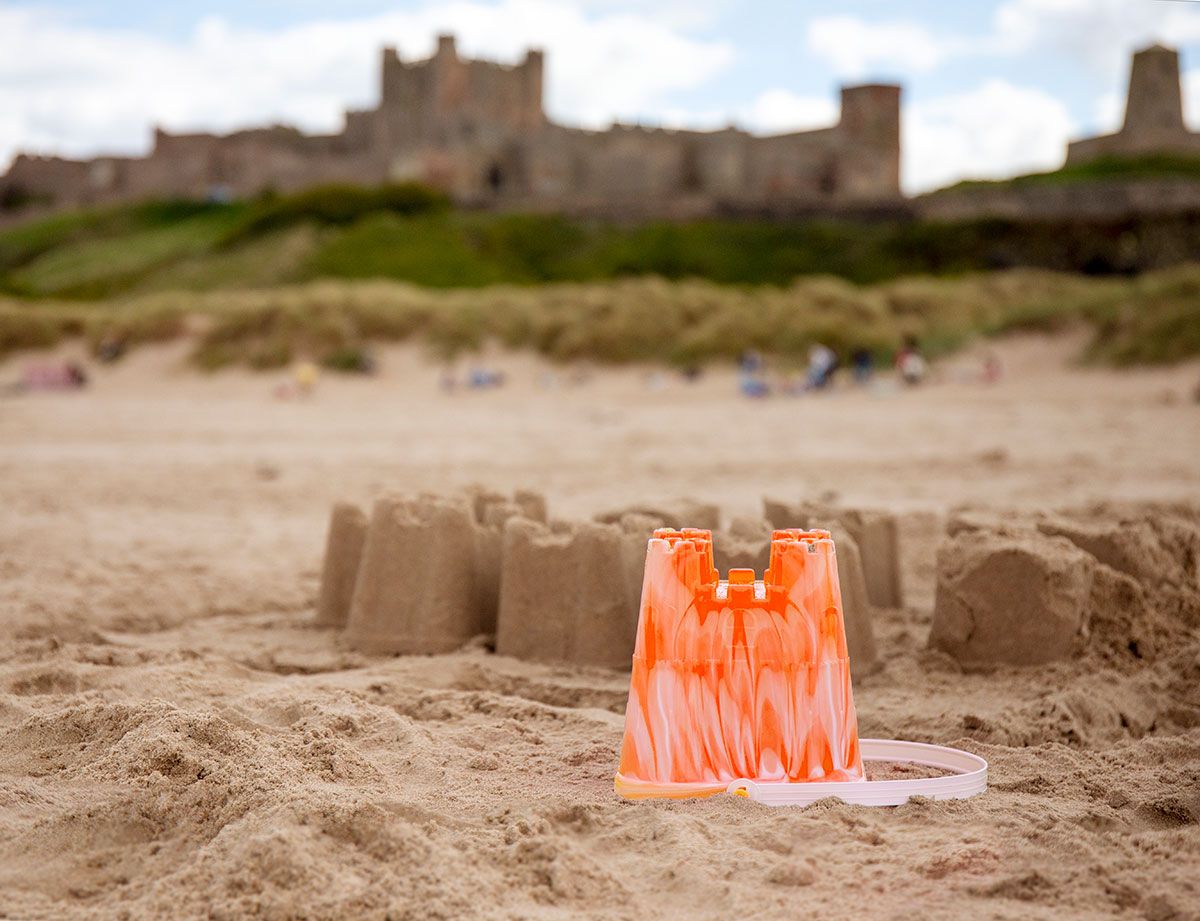 A series of sand castles built on the beach