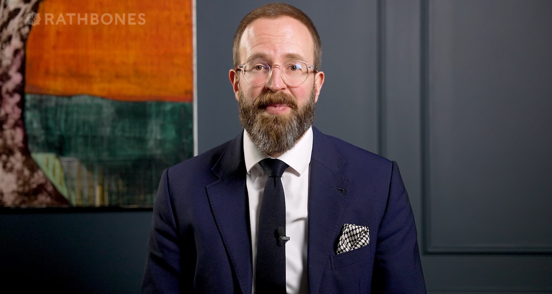 screengrab of Ed Smith wearing smart suit from video Investment Update thumbnail